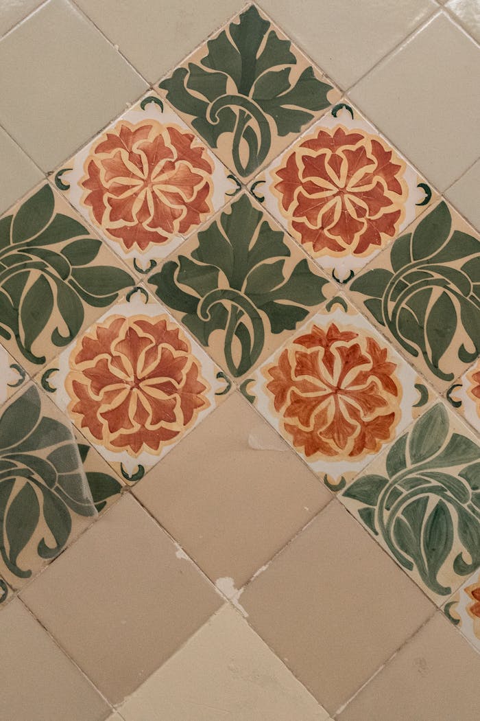 Detailed view of a traditional floral ceramic tile pattern found in Barcelona, showcasing rich colors.