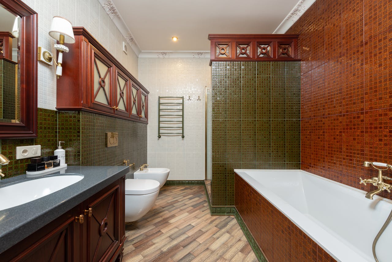 A beautifully designed traditional bathroom featuring luxurious fixtures and classic tiles.